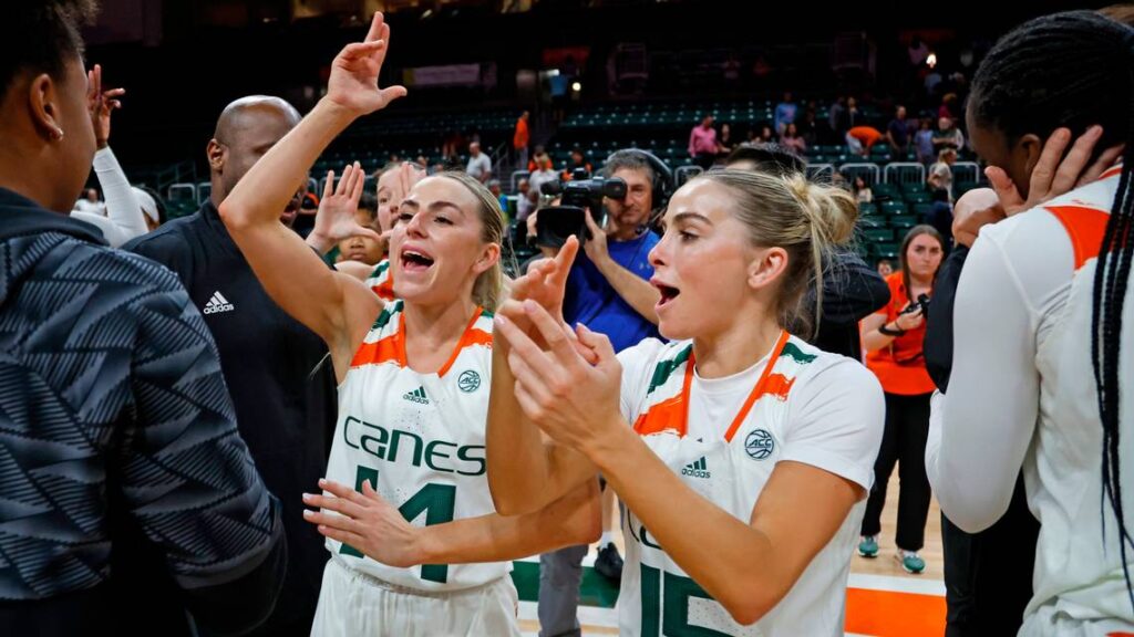 Miami WBB star sisters Haley and Hanna Cavinder celebrating win at the Watsco Center in Coral Gables, Florida